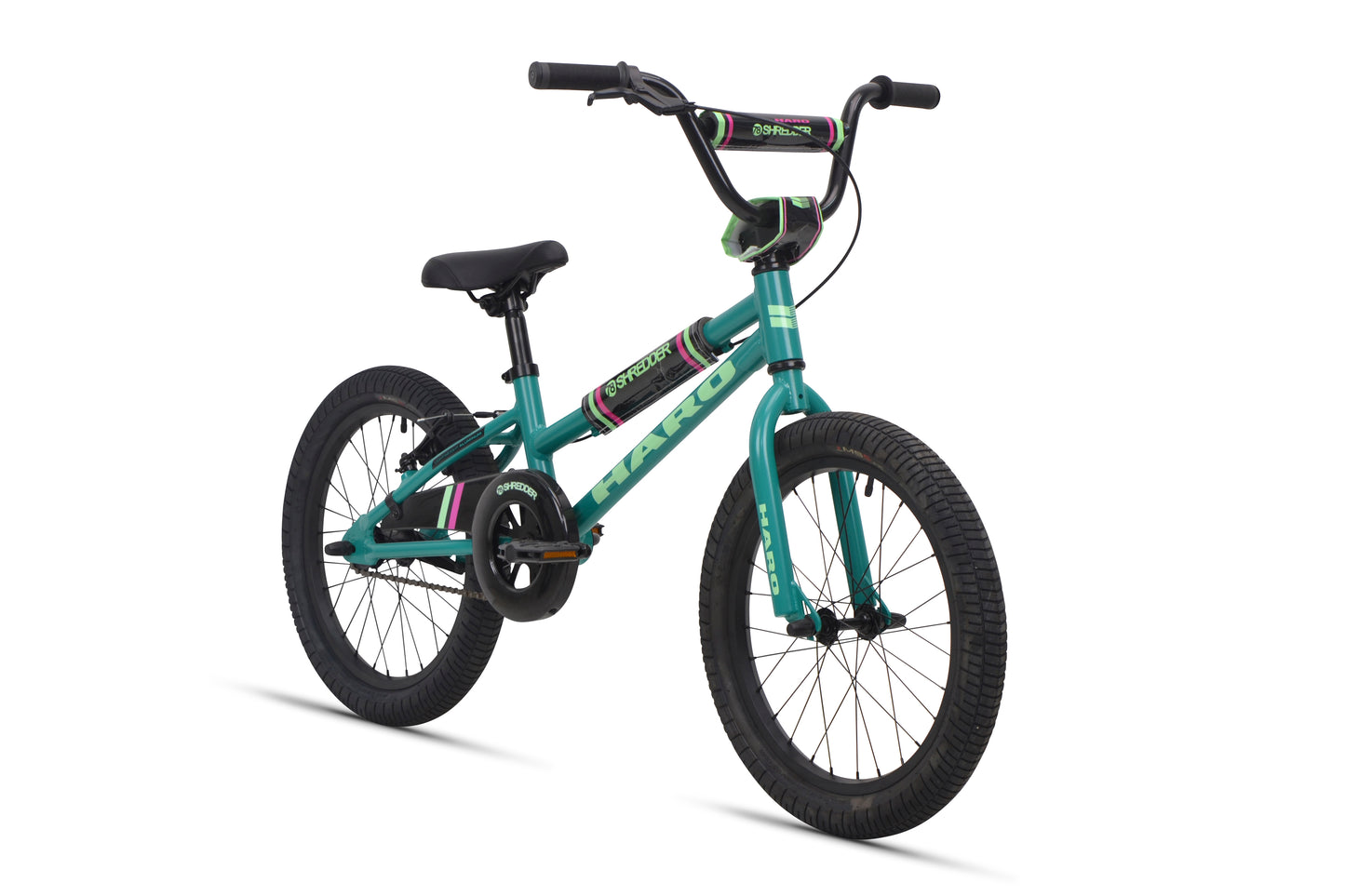 A teal Shredder 18 ST girls' bike with black tires, black seat, low top tube, green and purple accents; no training wheels.