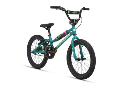 A teal Shredder 18 ST girls' bike with black tires, black seat, low top tube, green and purple accents; no training wheels.
