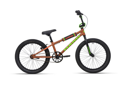 Shredder 20 BMX bike with alloy frame, black seat, 20" wheels, and green accents, side view on white background.