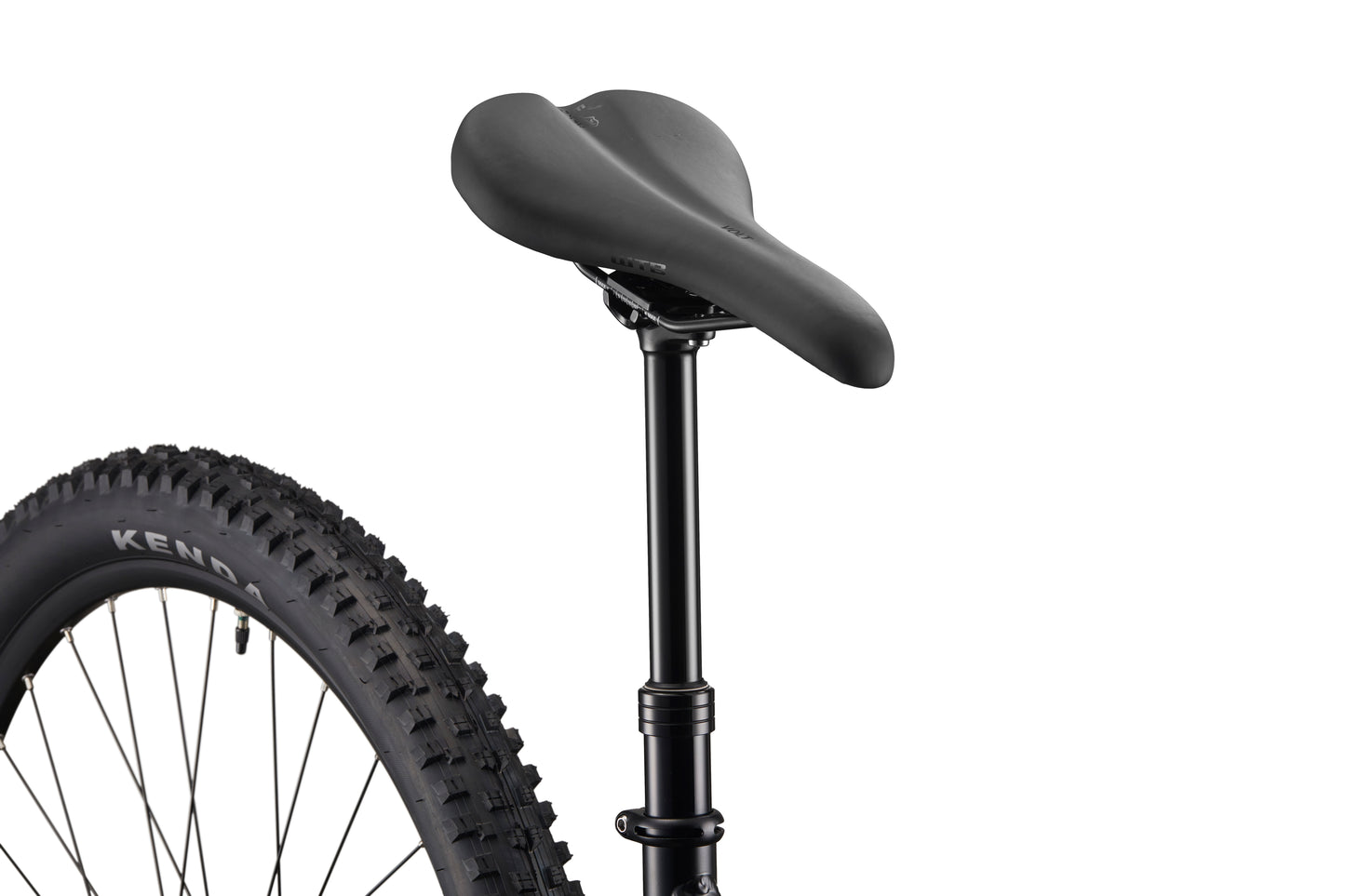 Close-up of Double Peak’s black bike seat, dropper post, seatpost, and rear tire against a white background.