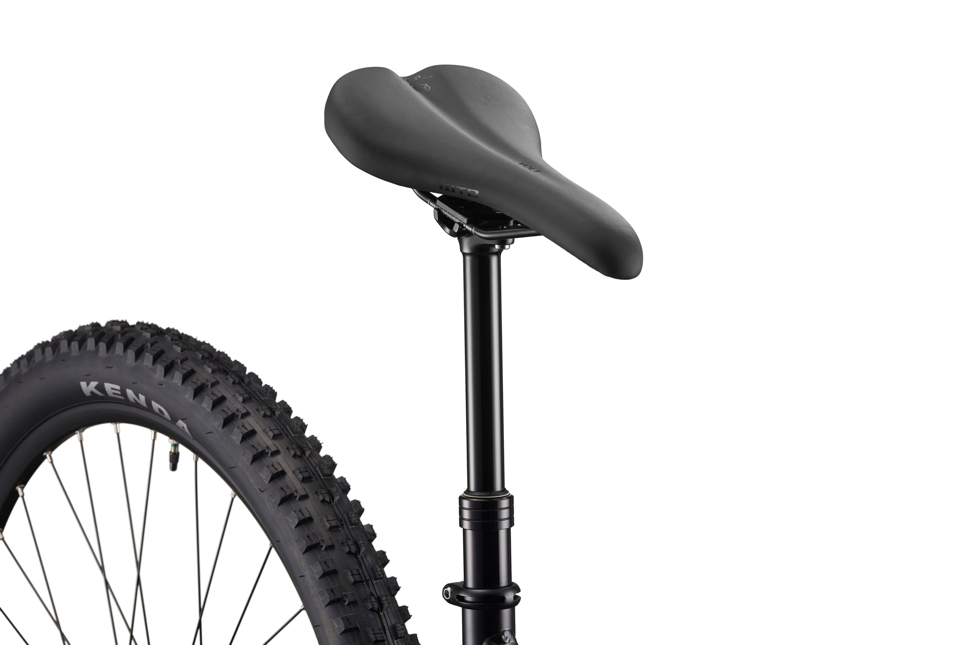 Close-up of Double Peak’s black bike seat, dropper post, seatpost, and rear tire against a white background.