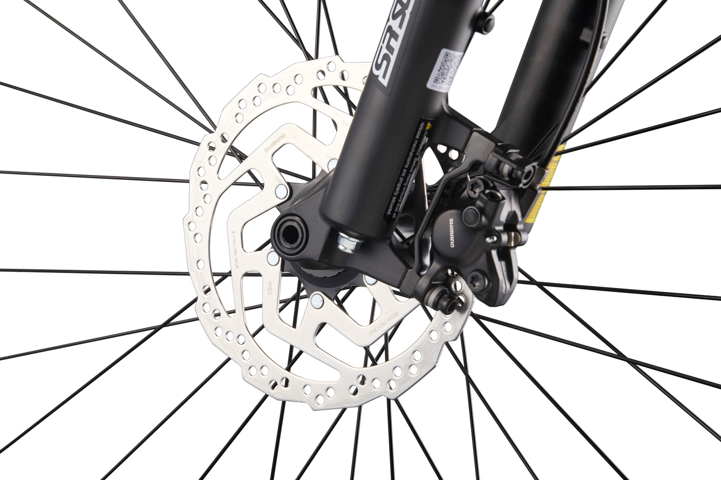 Close-up of Double Peak bike’s front wheel with spokes, hydraulic disc brakes, rotor, and caliper on white background.