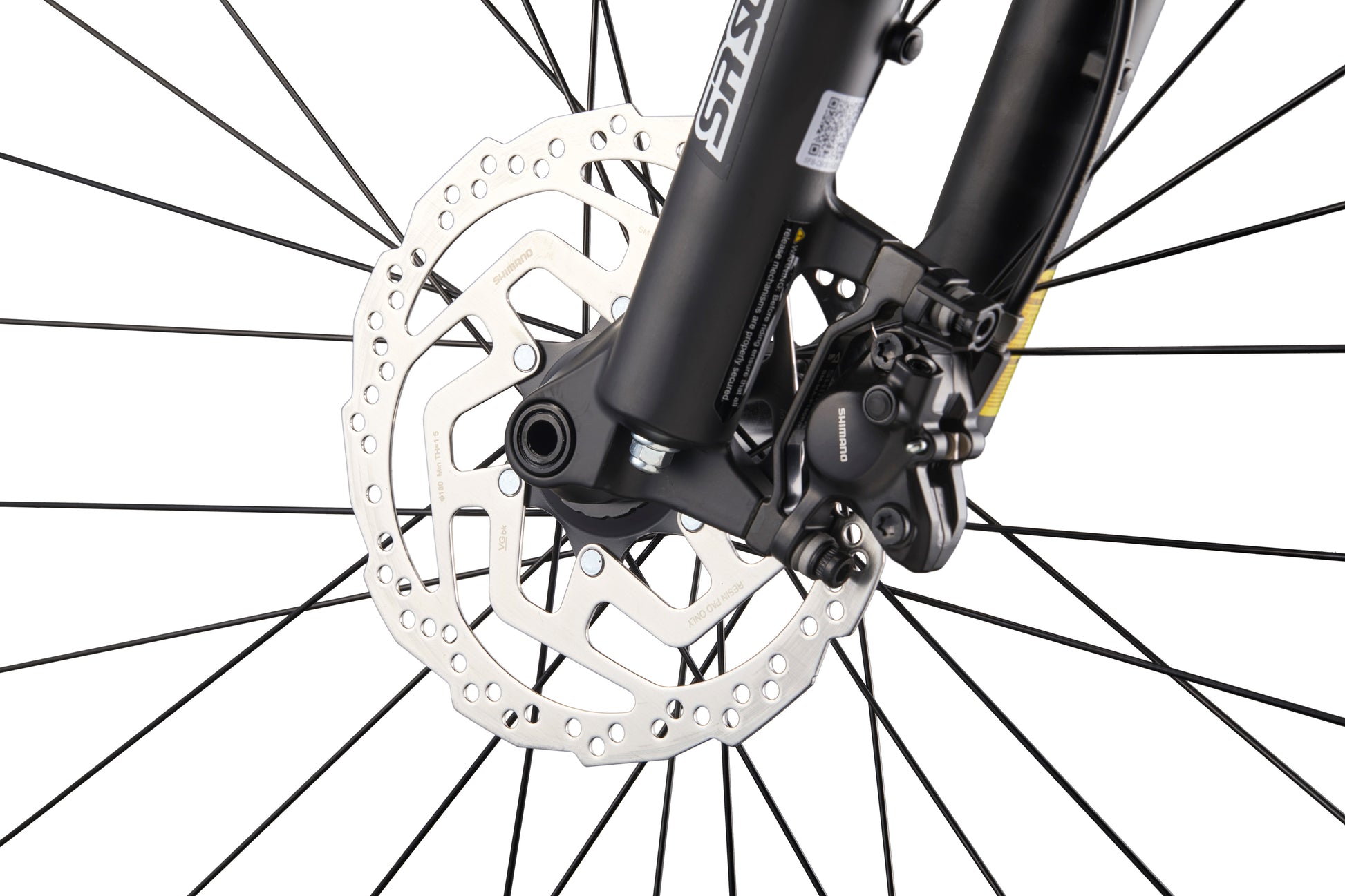 Close-up of Double Peak bike’s front wheel with spokes, hydraulic disc brakes, rotor, and caliper on white background.