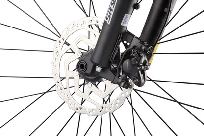 Close-up of Double Peak bike’s front wheel with spokes, hydraulic disc brakes, rotor, and caliper on white background.