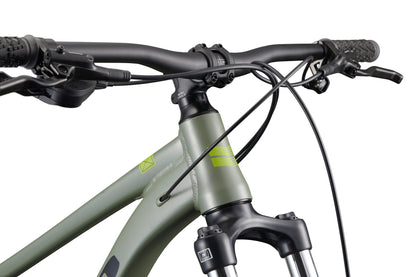 Close-up of Double Peak mountain bike handlebars, fork, and frame with 148 boost spacing for improved stability.