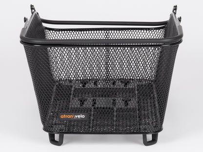 The Atran Velo Daily Basket Large is a black metal mesh bike basket with a sturdy rectangular design. It features an open top, reinforced edges, and an Atran Velo label on the front. Compatible with the AVS system for easy front-of-bike attachment.