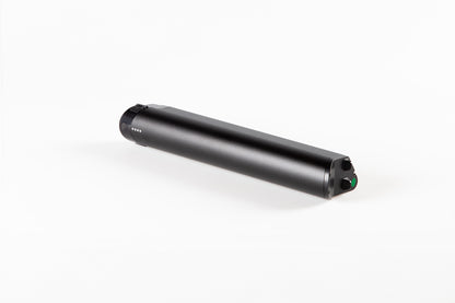 A sleek, cylindrical black Skwad Battery by Haro Bikes rests on a white background. It features a small green button and a digital display, making it perfect for replacing your electronic needs.