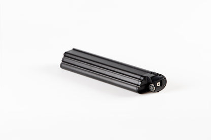 A black, cylindrical Skwad Battery by Haro Bikes rests on a white background, featuring a small connector and rounded edges. Its likely designed as a 48V replacement battery for specific Skwad Electric devices.