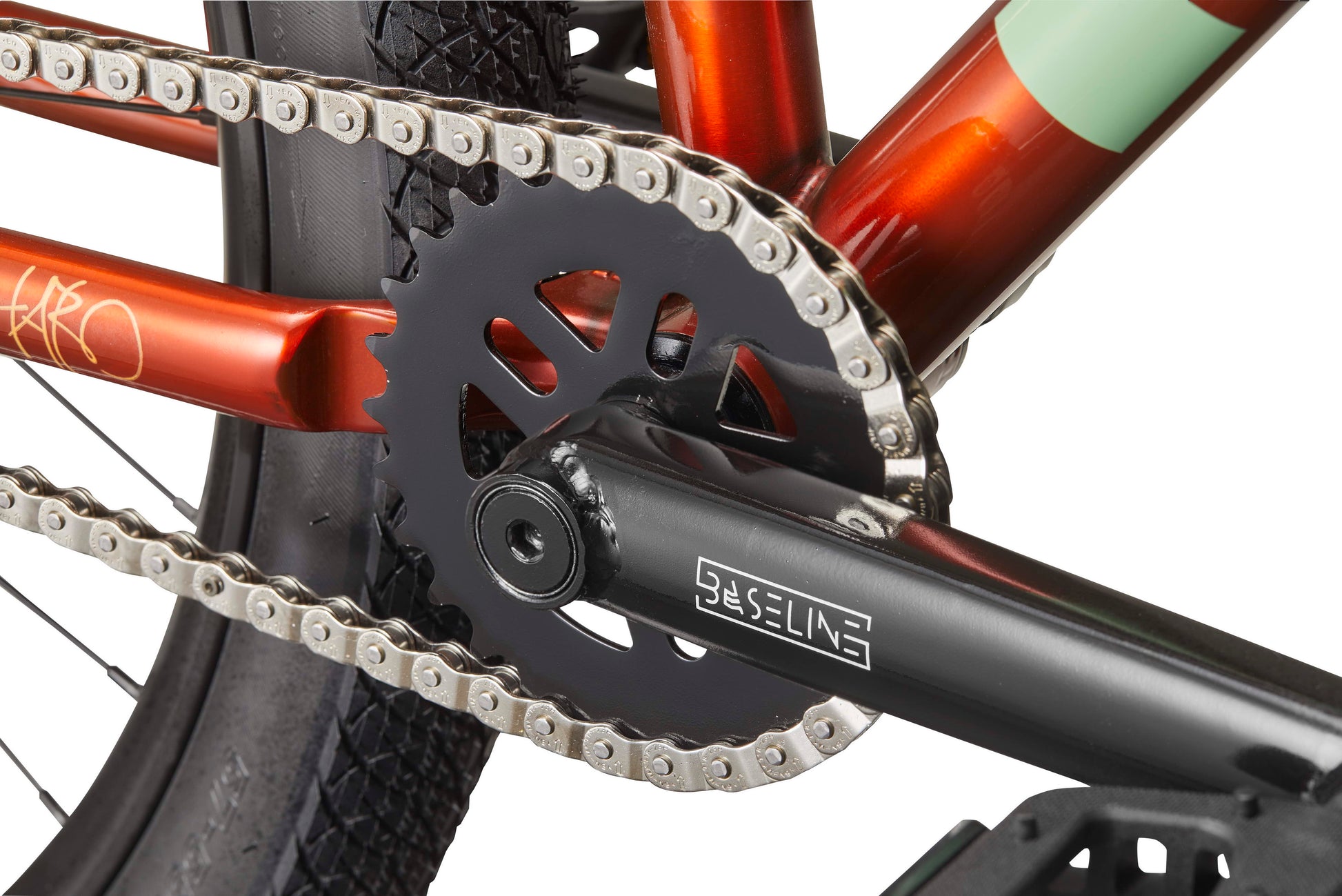 Close-up of a Steel Reserve crankset, highlighting the chain, chainring, and pedal on its chromoly frame.