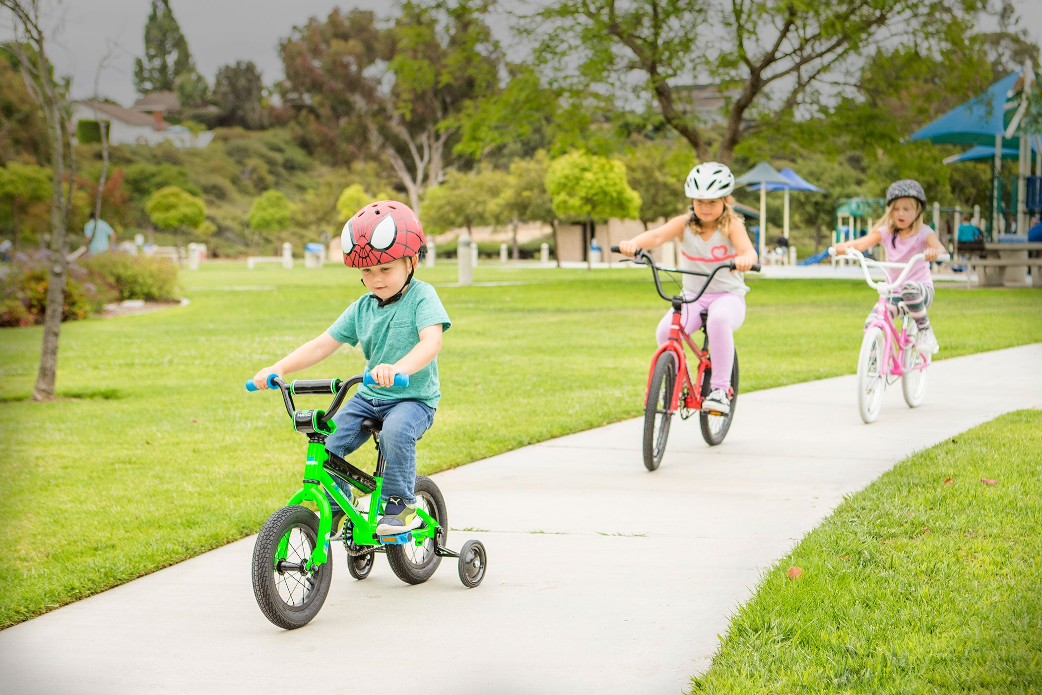 Kids riding bikes in a park