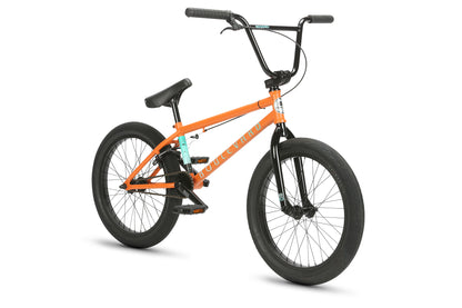 The Boulevard 20.5 by Haro Bikes, an orange BMX bike, showcases the BMX lifestyle with its black handlebars, seat, and tires set against a plain white background. Its sleek frame and minimalist design offer durability for enthusiasts craving adventure.