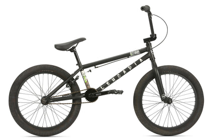 The black Leucadia BMX features a sleek frame, thick tires, padded seat, wide handlebars, and pedal cranks, perfect for freestyle or street riding.