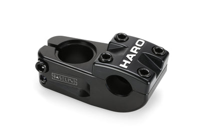 A sleek, modern black bicycle stem crafted from CNC-machined 6061 aluminum with HARO boldly printed on top in white, the Baseline Top Load CNC Stem by Haro Bikes features multiple bolts for secure attachment.