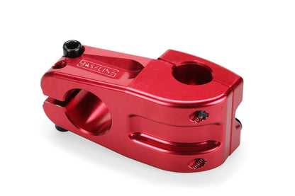 The Haro Bikes Baseline Top Load CNC Stem is shiny red, made from 6061 aluminum with a cylindrical opening, multiple screw holes, and an engraved logo on its smooth surface for durability and style.