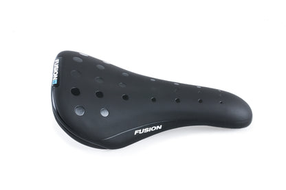 The Fusion Stealth Seat by Haro Bikes is a black, ergonomic bike saddle with a smooth surface and circular perforations. Fusion appears in white on the side. Photographed against a plain white background, it offers a sleek design for optimal comfort.