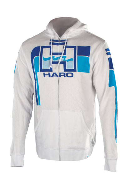 A Haro Retro Hoody by Haro Bikes, this white zip-up hoodie features the HARO logo, blue accents with geometric shapes, and a stylized graphic on the front and sleeves. It includes a drawstring hood.